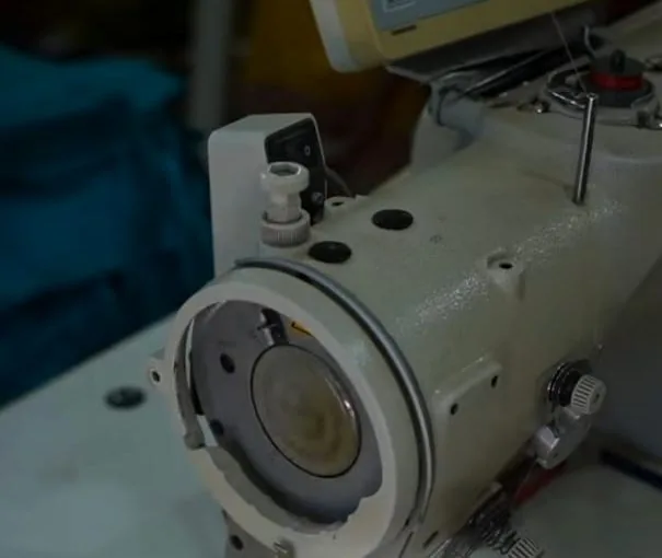 Multi-head neckline and border embroidery machine