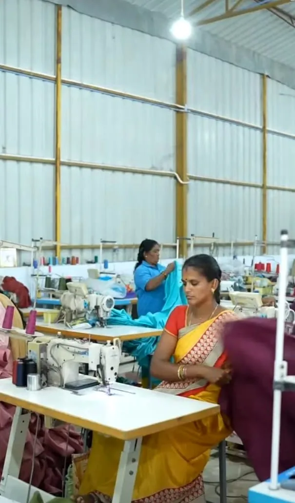Tailors finishing garments piece by piece